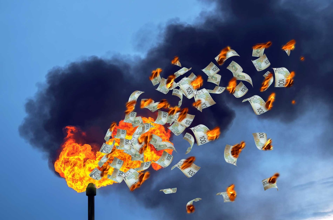 Smoke stack flaring with red flames and money